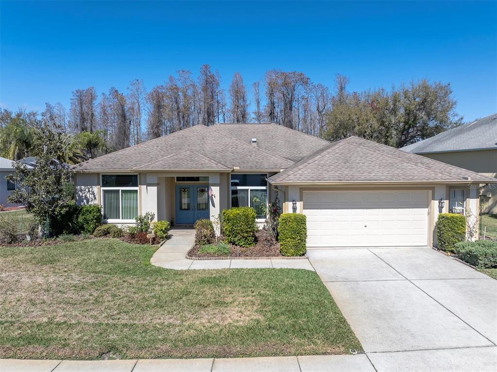 1014 Arlinbrook Drive Trinity, FL 34655 - Photo 1 of 69 a front view of a house with garden