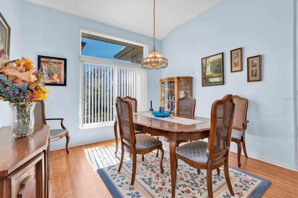 1014 Arlinbrook Drive Trinity, FL 34655 - Photo 11 of 69 a view of a dining room with furniture window and wooden floor