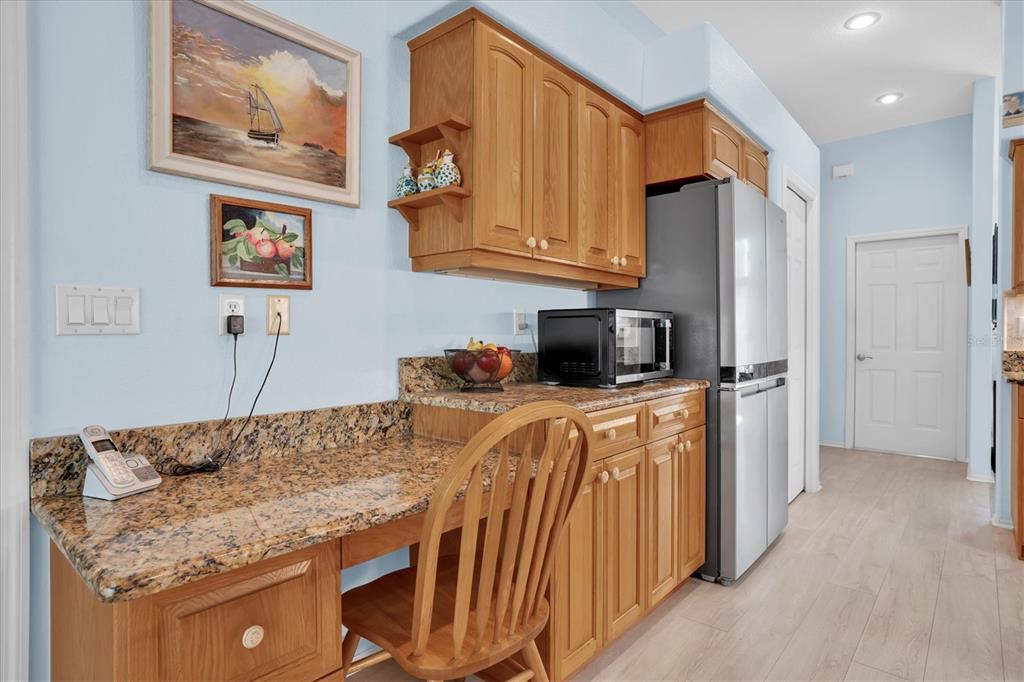 1014 Arlinbrook Drive Trinity, FL 34655 - Photo 14 of 69 a kitchen with stainless steel appliances granite countertop a refrigerator a stove and a sink