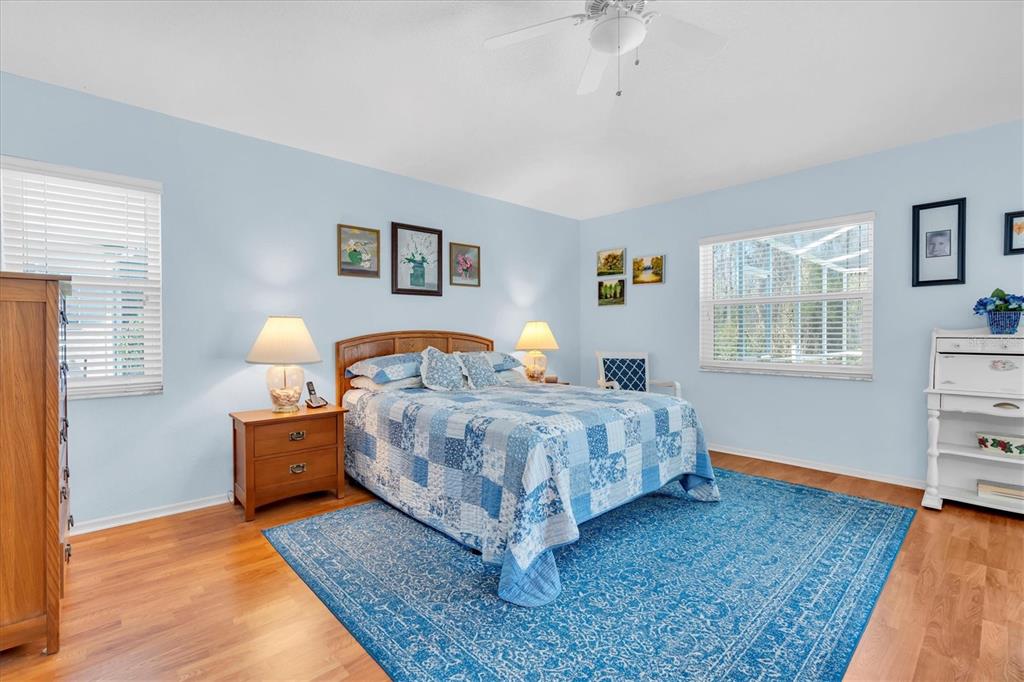 1014 Arlinbrook Drive Trinity, FL 34655 - Photo 21 of 69 a bedroom with a bed and lamp with window