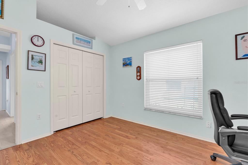 1014 Arlinbrook Drive Trinity, FL 34655 - Photo 27 of 69 a view of a room with wooden floor and window