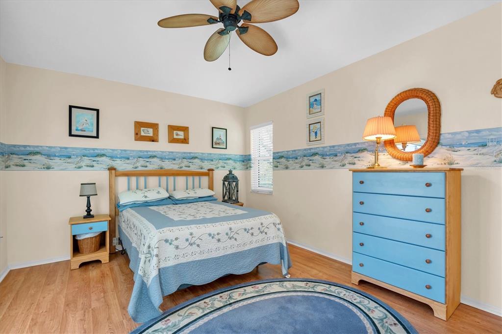 1014 Arlinbrook Drive Trinity, FL 34655 - Photo 29 of 69 a bedroom with a bed and a dresser