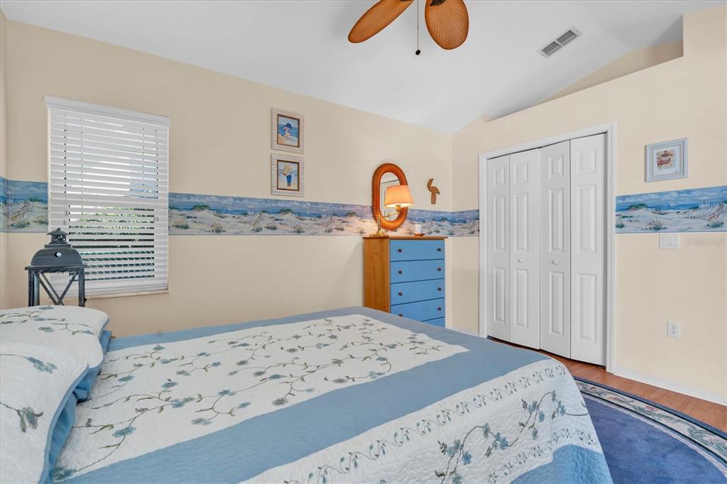 1014 Arlinbrook Drive Trinity, FL 34655 - Photo 30 of 69 a bedroom with a bed and a dresser