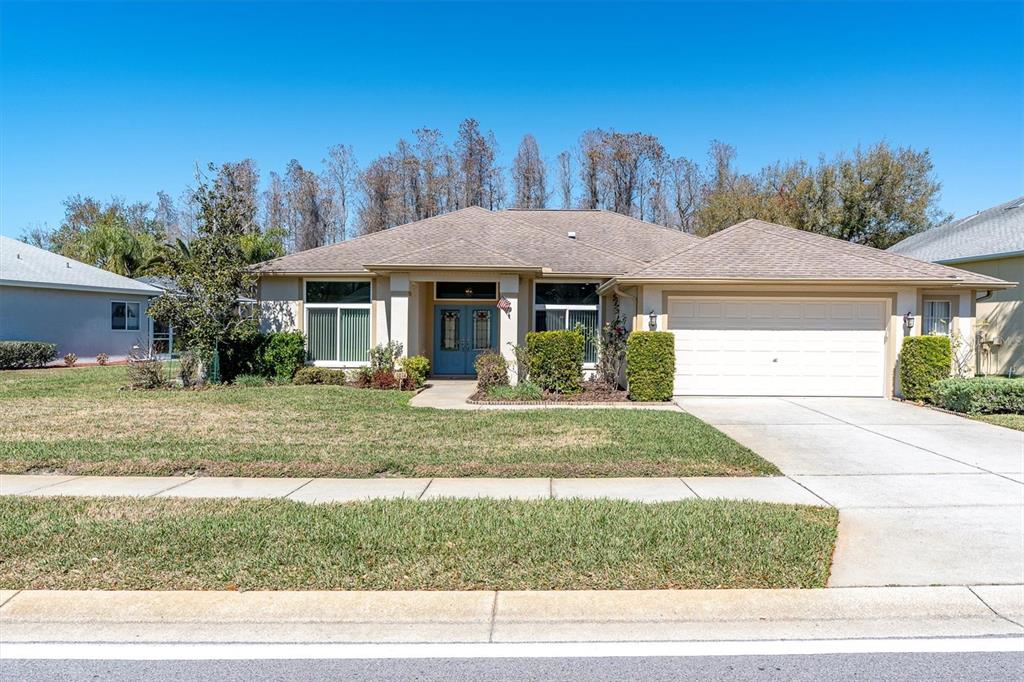 1014 Arlinbrook Drive Trinity, FL 34655 - Photo 49 of 69 a front view of a house with a yard