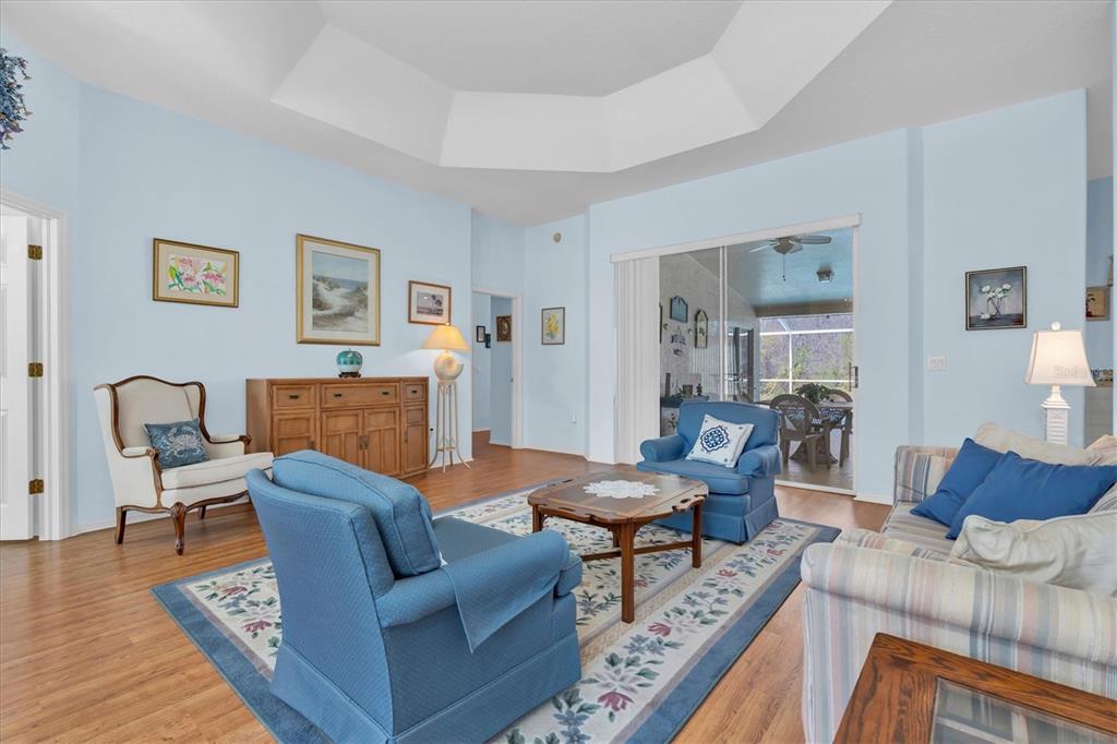 1014 Arlinbrook Drive Trinity, FL 34655 - Photo 7 of 69 a living room with furniture and wooden floor