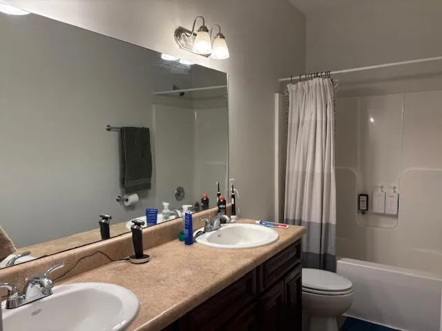 a bedroom with a bed and a desk