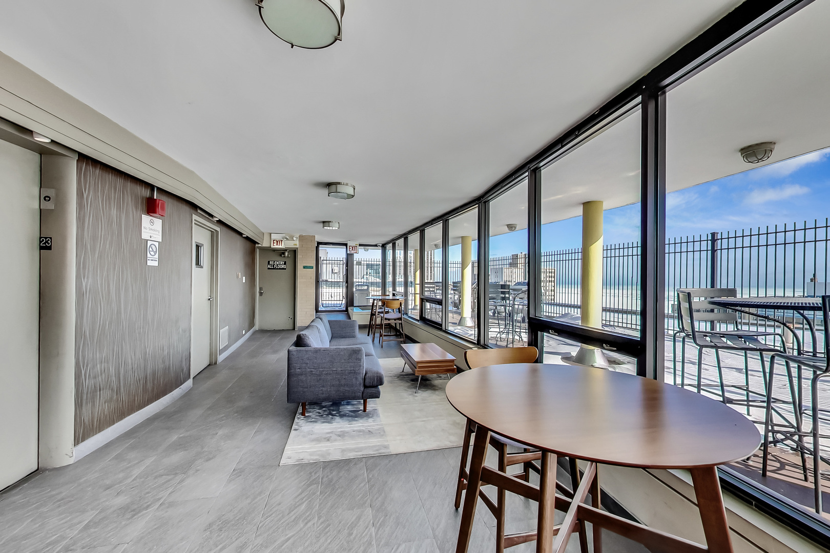 2930 North Sheridan Road, Unit 2111 Chicago, IL 60657 - Photo 23 of 31 a dining room with furniture window and wooden floor