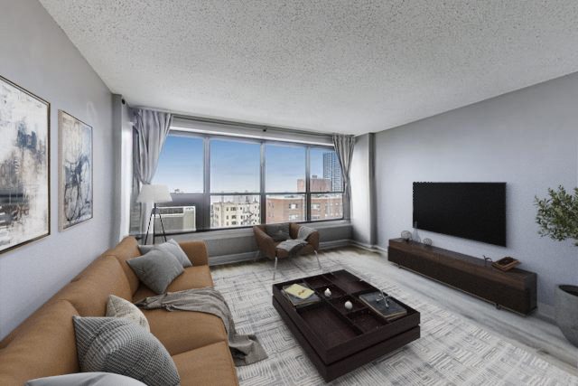 2930 North Sheridan Road, Unit 2111 Chicago, IL 60657 - Photo 4 of 31 a living room with furniture and a flat screen tv