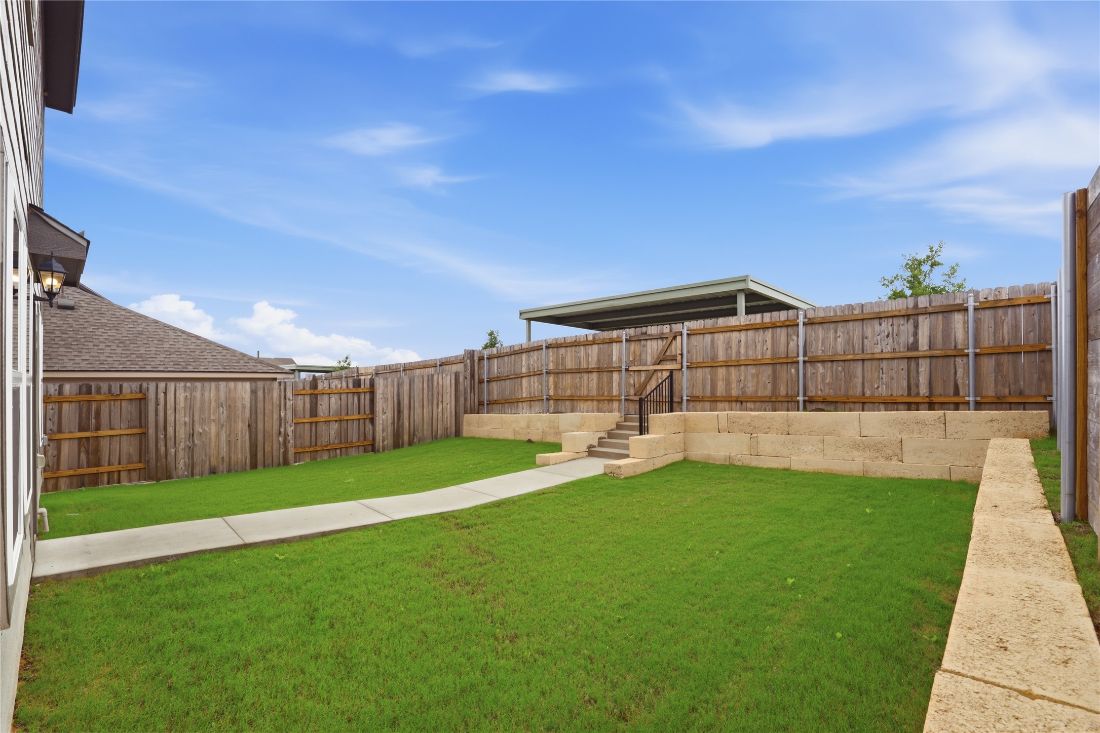 9320 Gladsome Path Manor, TX 78653 - Photo 29 of 34 a view of a backyard with a garden