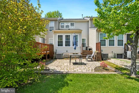 a view of a house with furniture and garden