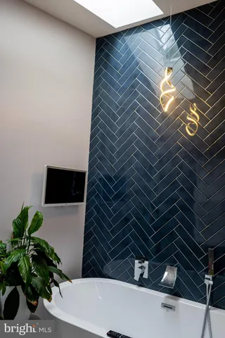 a bathroom with a sink and a window