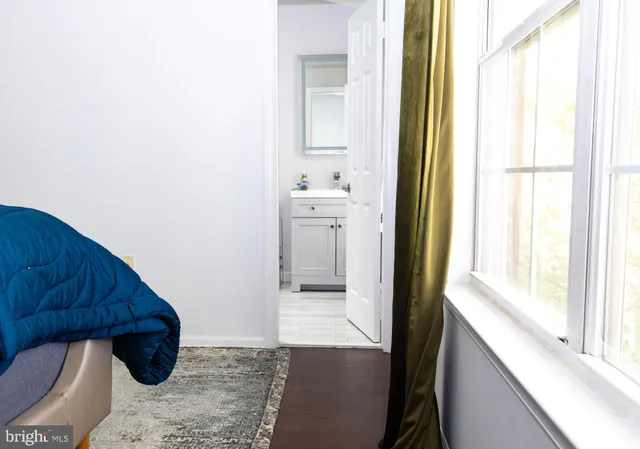 a white toilet sitting next to a bathroom sink