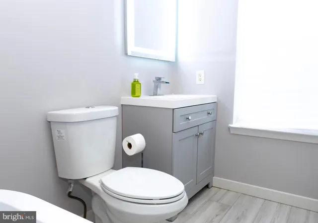 a white building with a potted plant