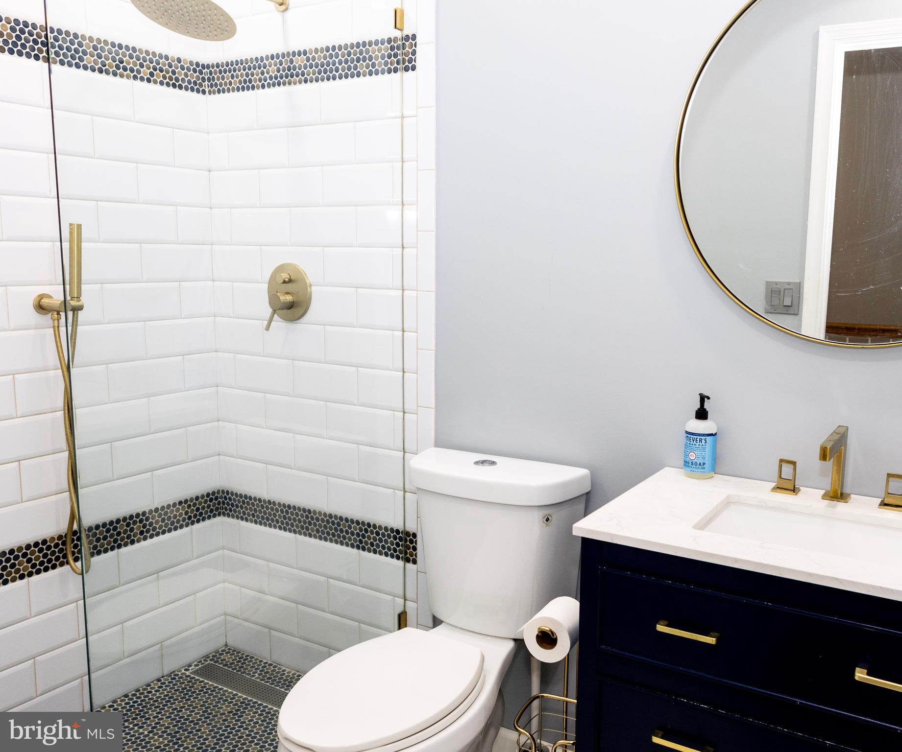 2429 Lizbec Court Crofton, MD 21114 - Photo 21 of 31 a bathroom with a sink a toilet and shower