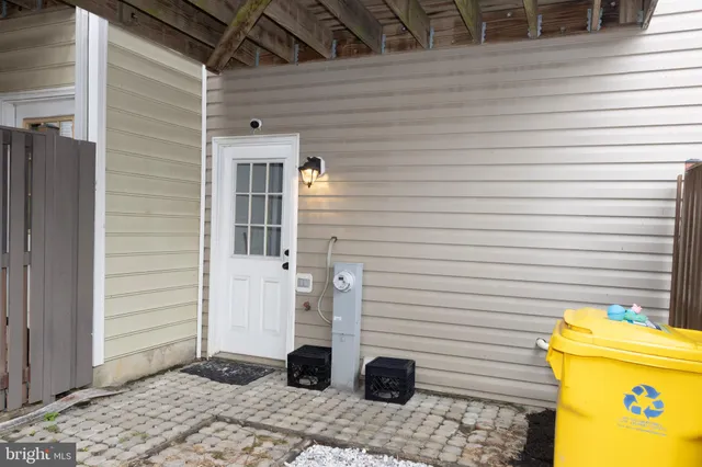 a view of a house with wooden fence