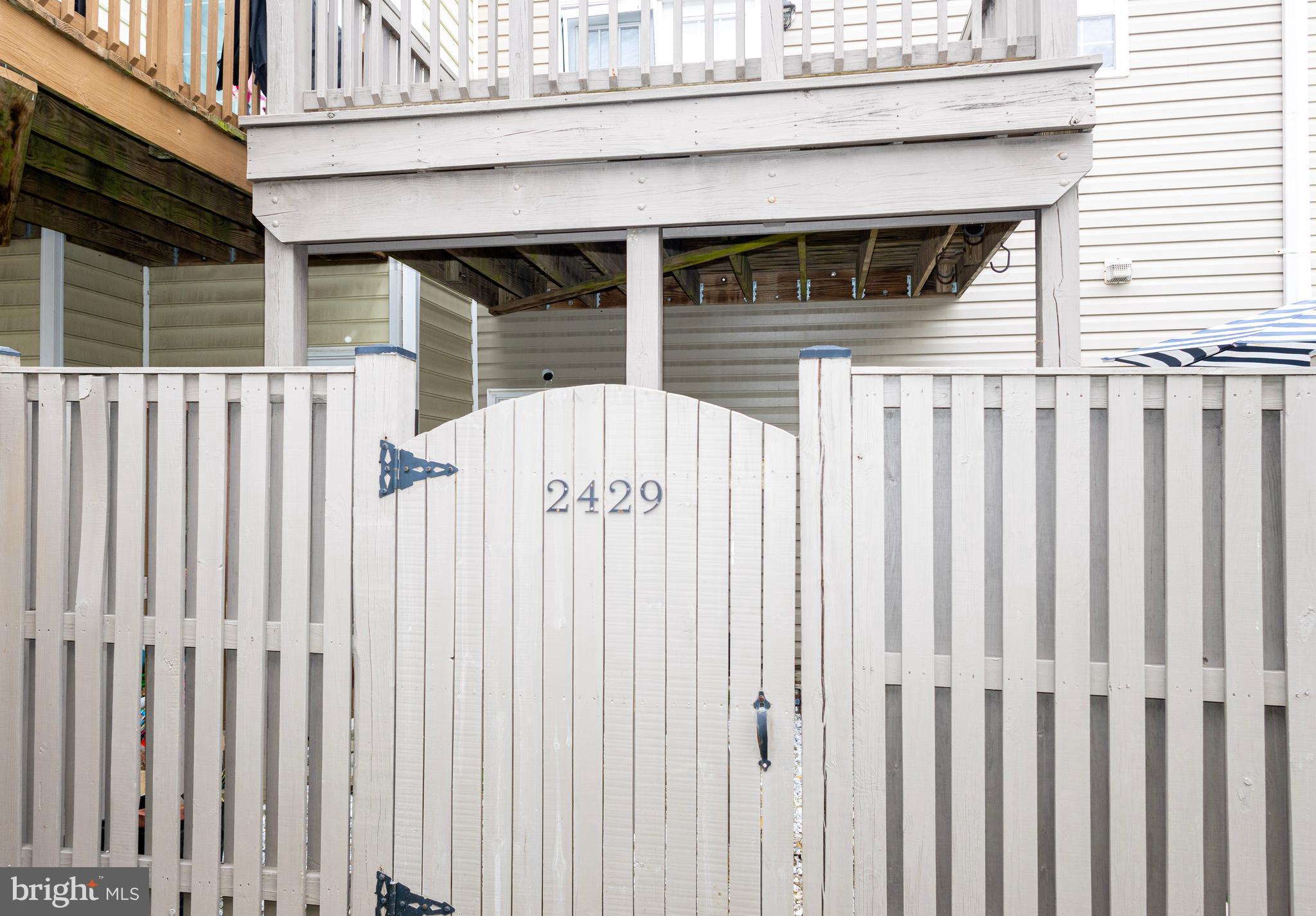 2429 Lizbec Court Crofton, MD 21114 - Photo 29 of 31 a view of a house with wooden fence