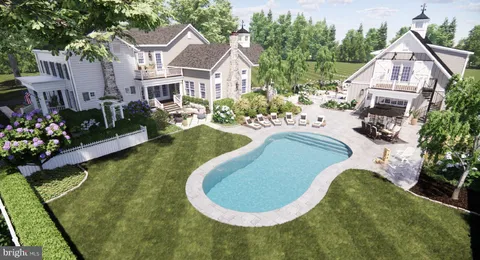 a view of a house with swimming pool and sitting area