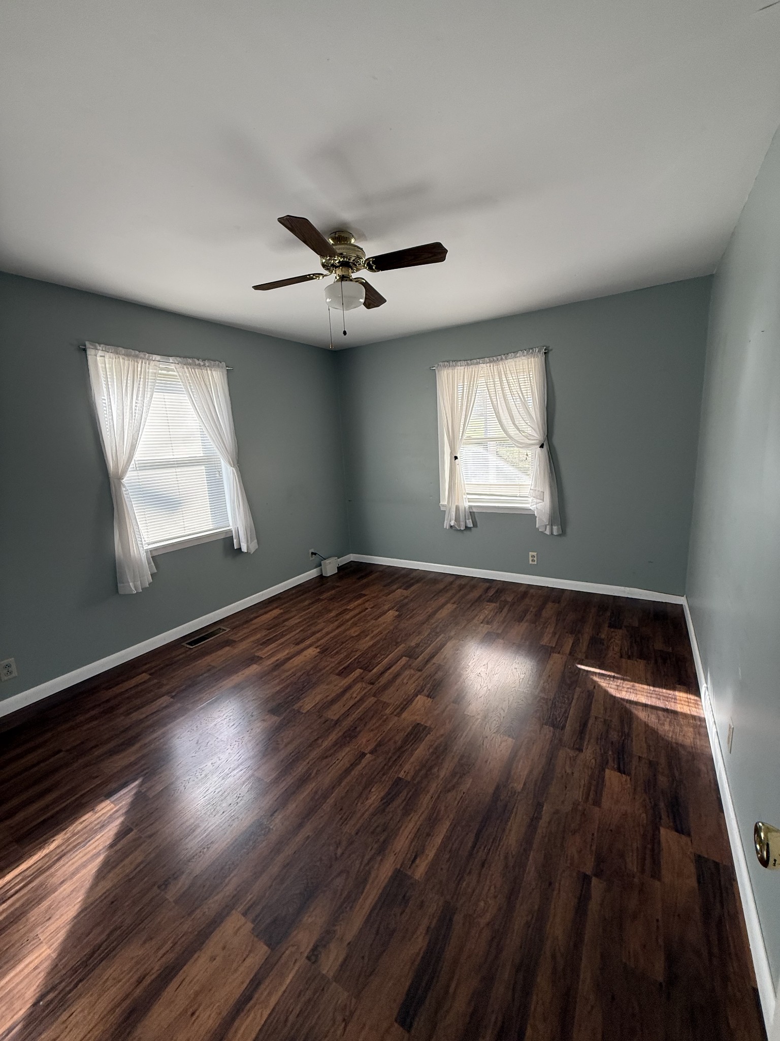 2352 Spring Creek Road Lafayette, TN 37083 - Photo 11 of 11 wooden floor in an empty room with a window