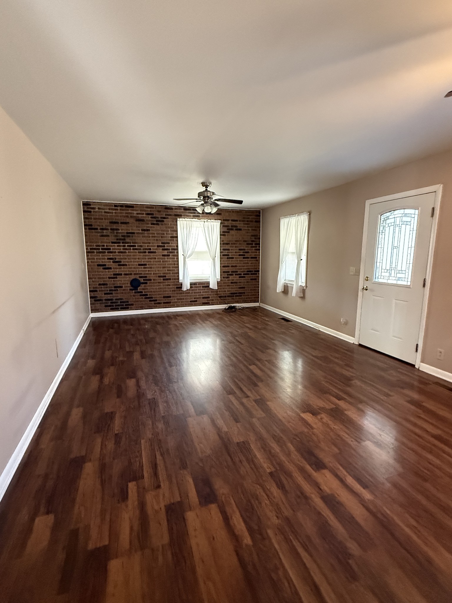 2352 Spring Creek Road Lafayette, TN 37083 - Photo 6 of 11 an empty room with wooden floor and windows