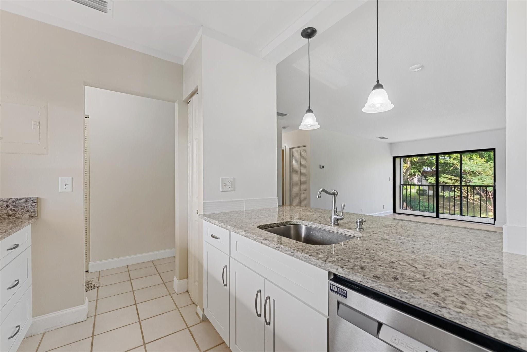 a kitchen with sink and window