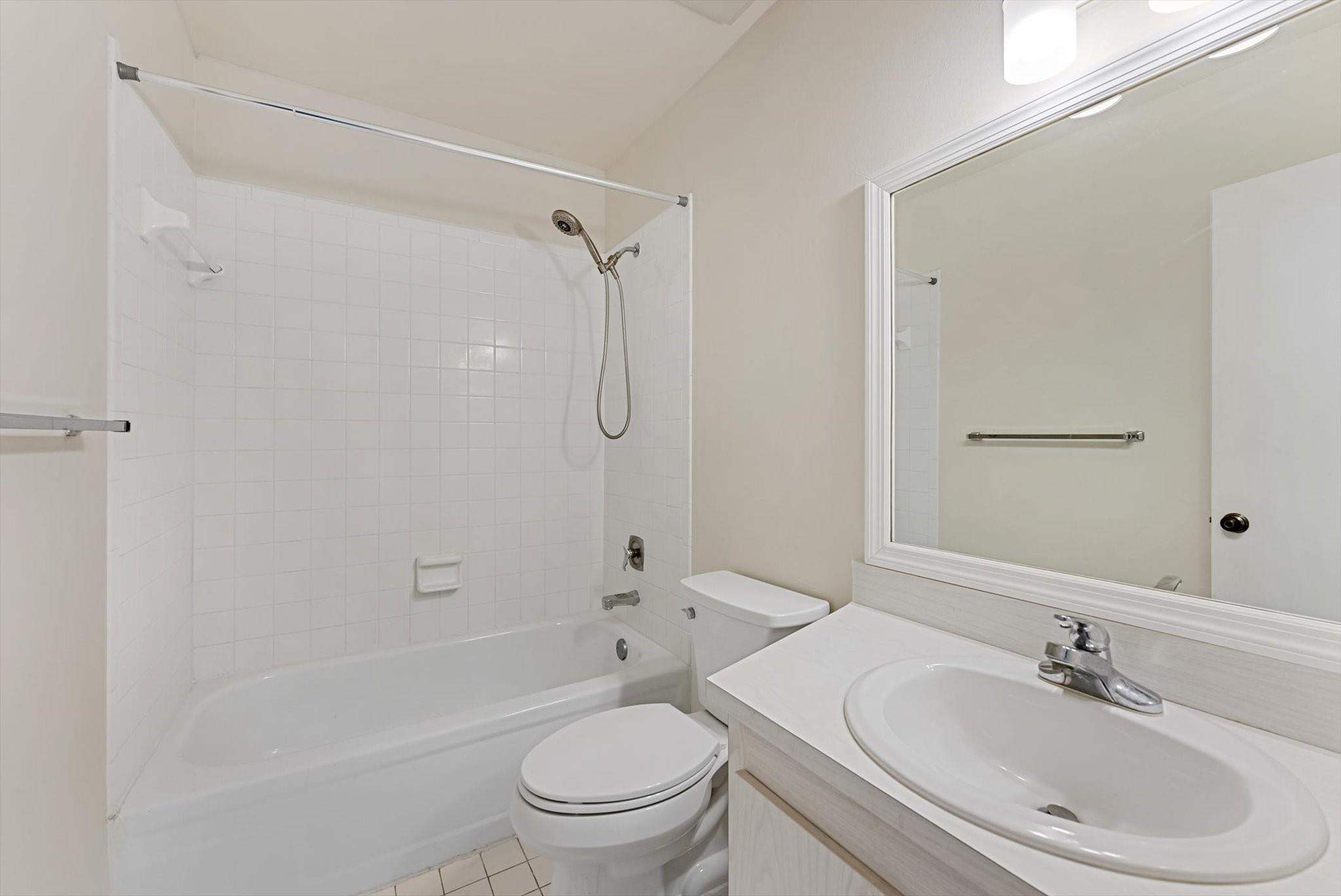 160 Northwest 70th Street, Unit 204 Boca Raton, FL 33487 - Photo 20 of 31 a bathroom with a sink toilet and shower
