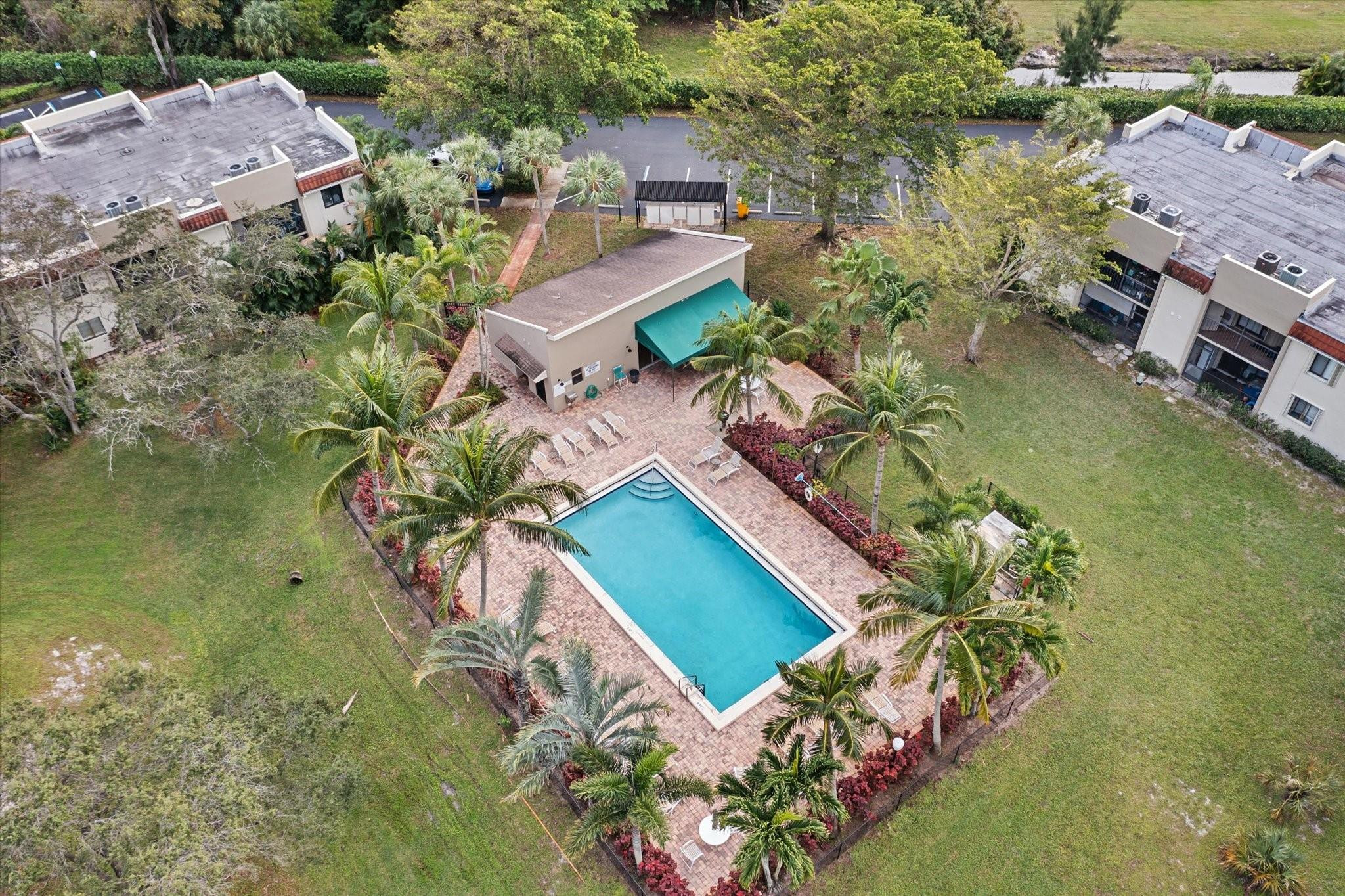160 Northwest 70th Street, Unit 204 Boca Raton, FL 33487 - Photo 24 of 31 an aerial view of a house with a yard and lake view