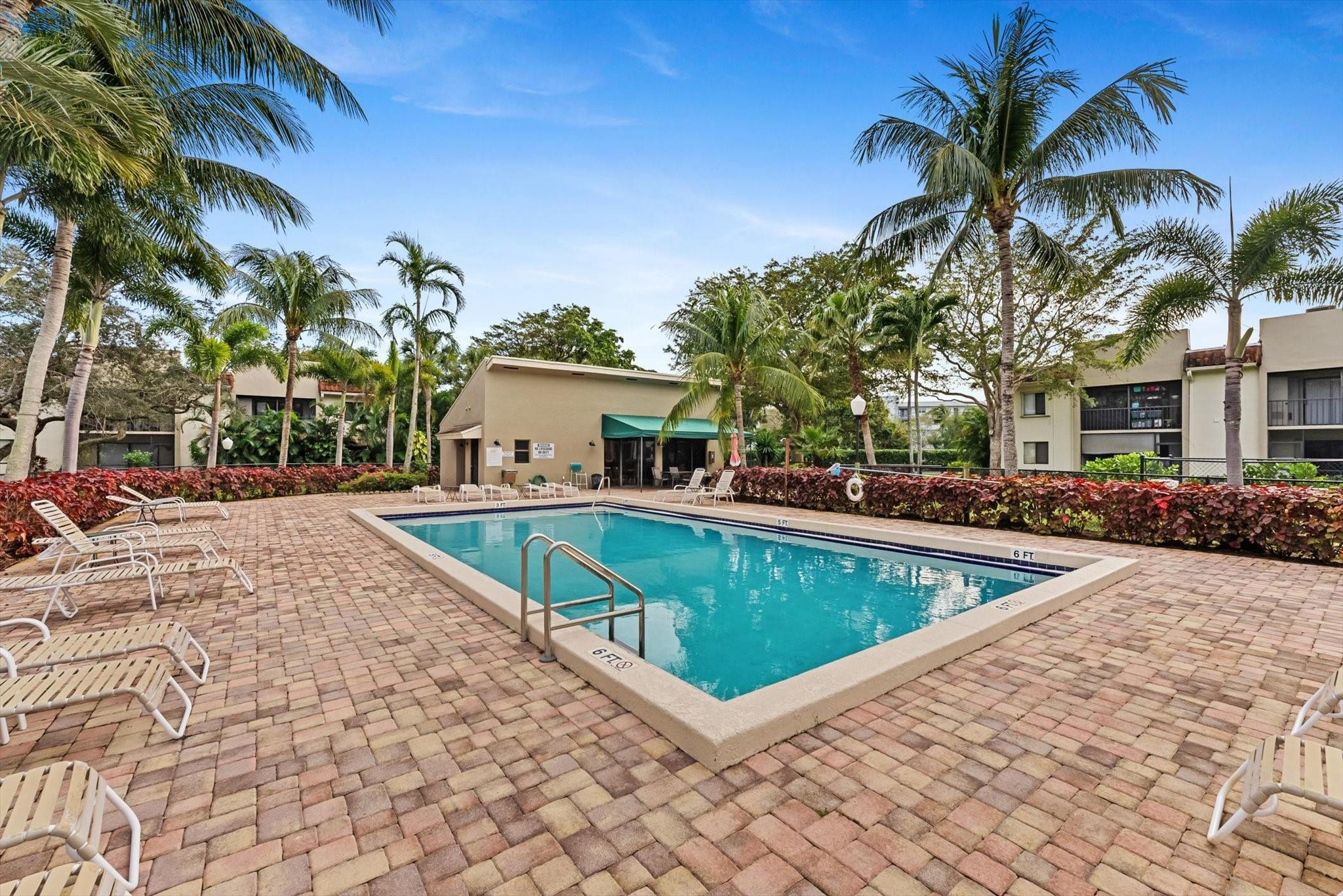 160 Northwest 70th Street, Unit 204 Boca Raton, FL 33487 - Photo 25 of 31 a view of a house with swimming pool
