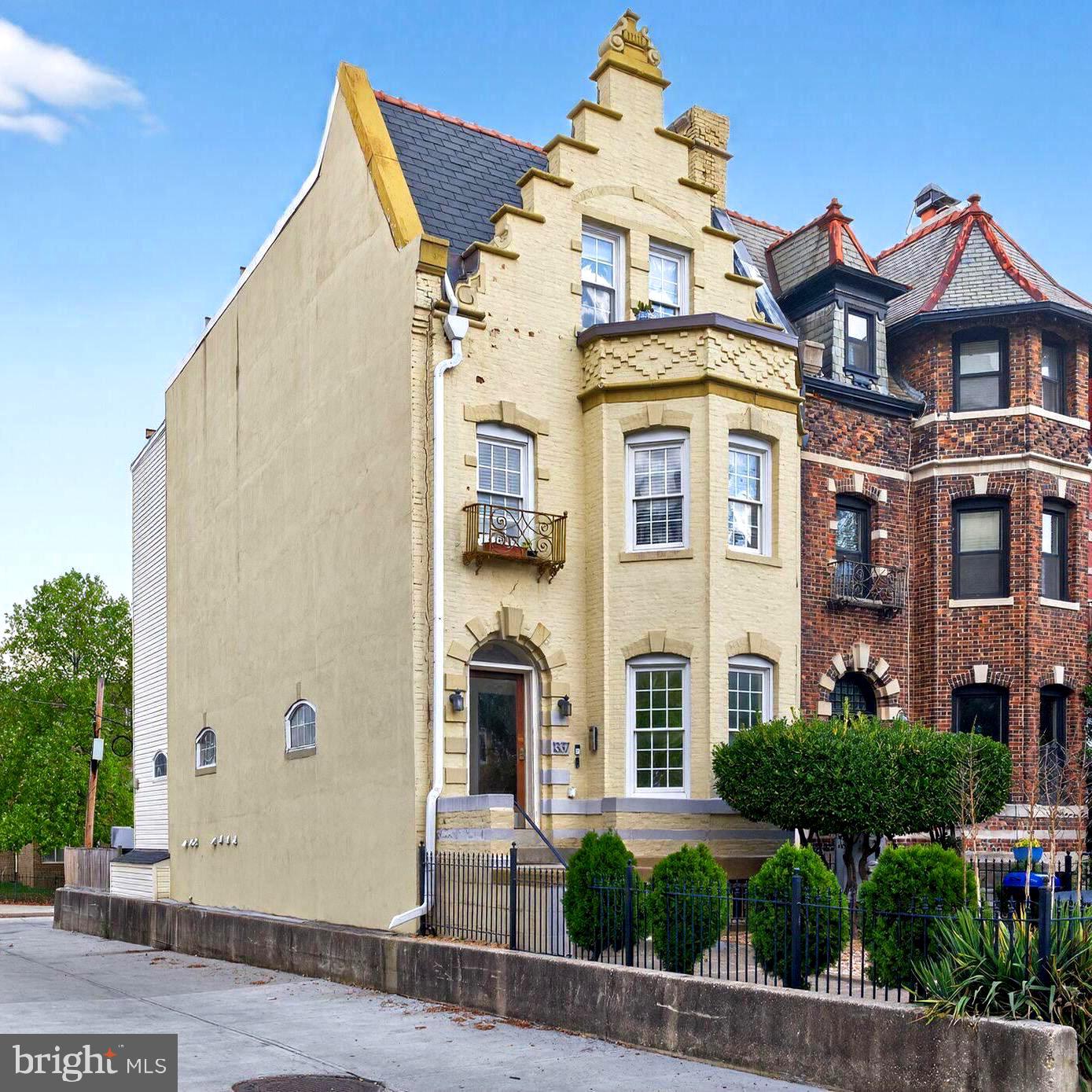 1337 Harvard Street Northwest, Unit 1 Washington, DC 20009 - Photo 1 of 20 a front view of a residential houses with yard