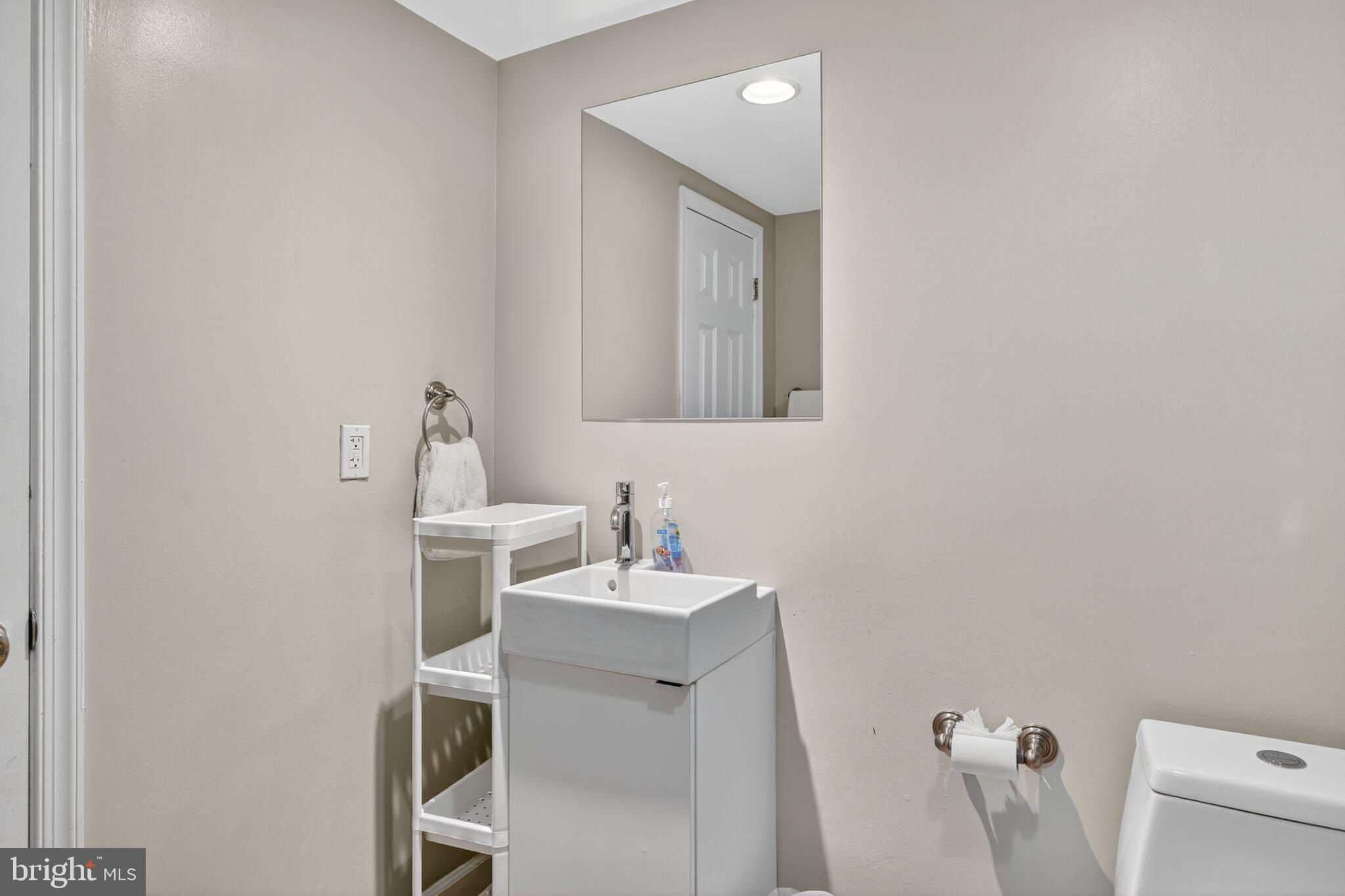 1337 Harvard Street Northwest, Unit 1 Washington, DC 20009 - Photo 16 of 20 a bathroom with a sink and a toilet