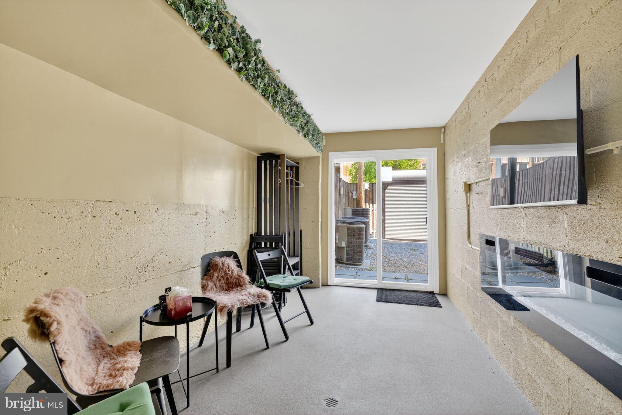 1337 Harvard Street Northwest, Unit 1 Washington, DC 20009 - Photo 17 of 20 a living room with furniture and a potted plant