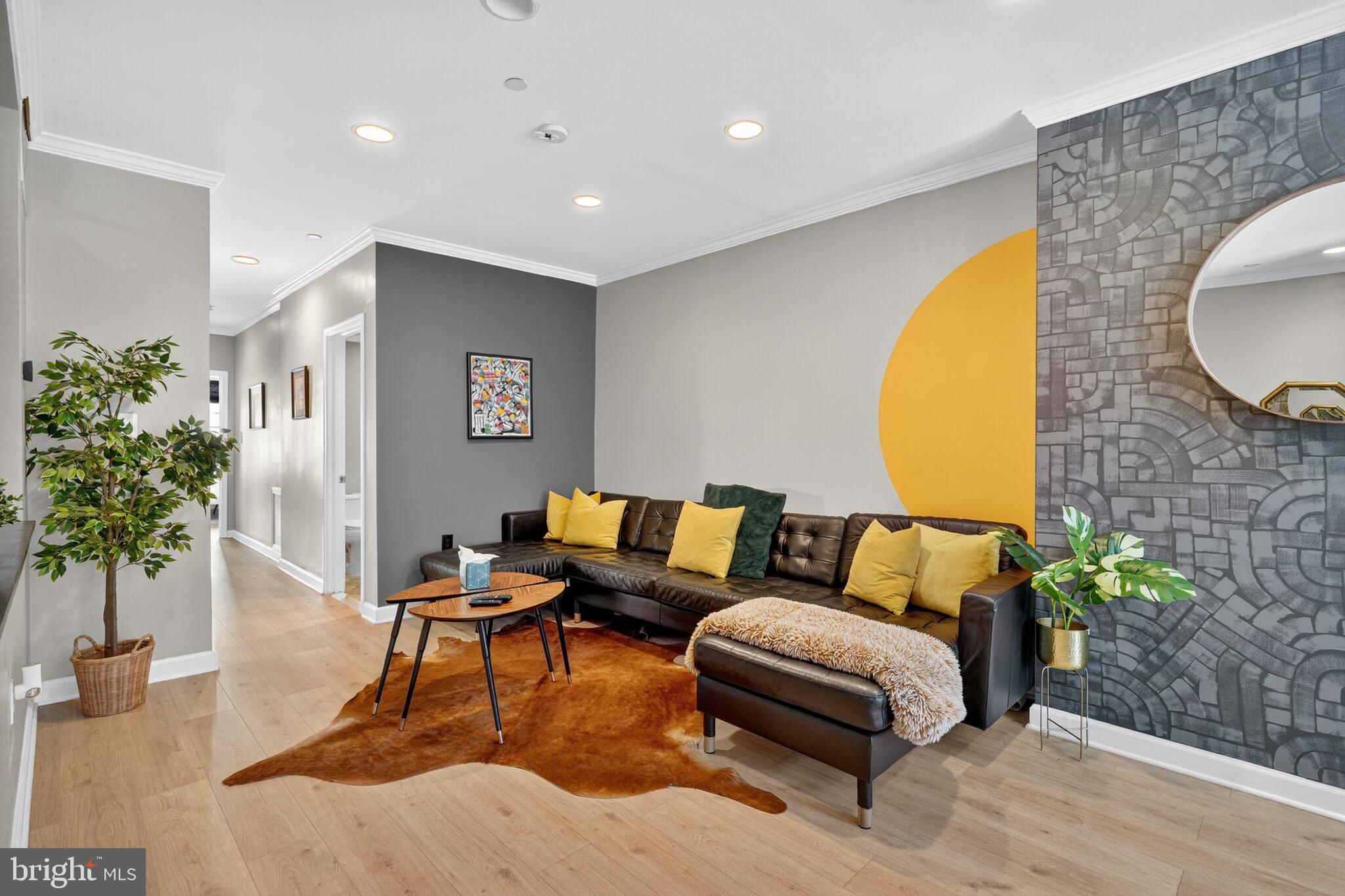 1337 Harvard Street Northwest, Unit 1 Washington, DC 20009 - Photo 3 of 20 a living room with furniture and flowers