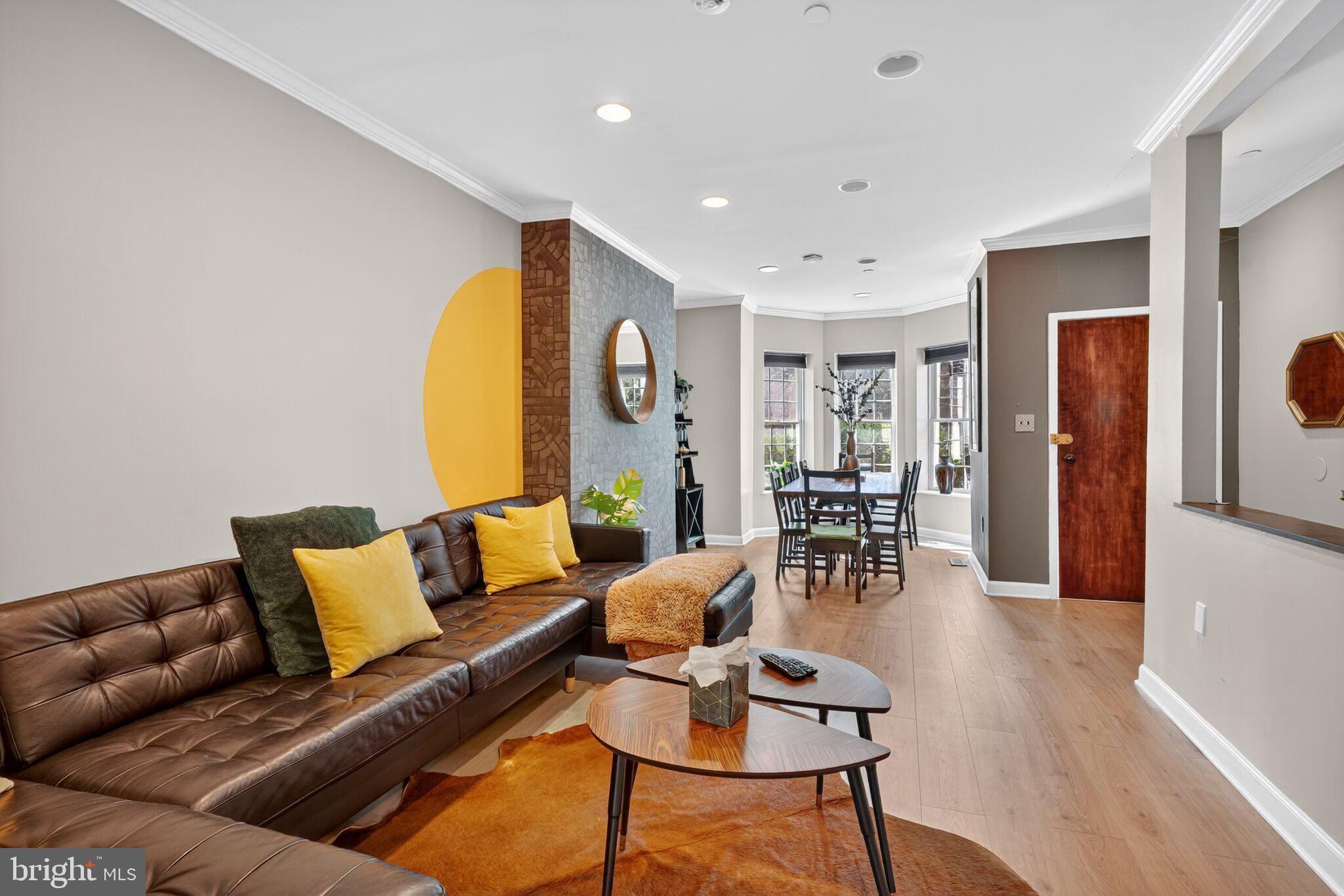 1337 Harvard Street Northwest, Unit 1 Washington, DC 20009 - Photo 4 of 20 a living room with furniture and wooden floor