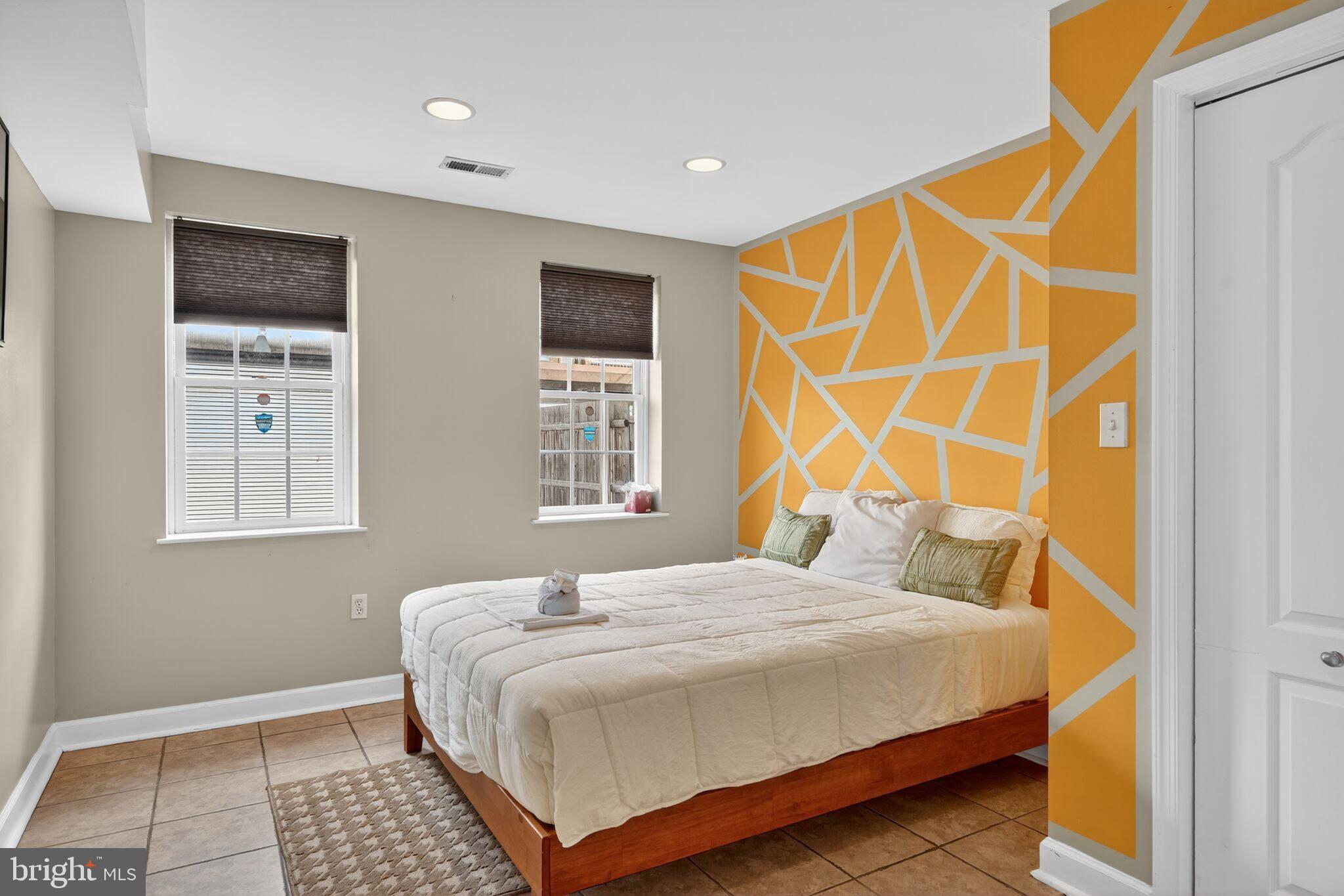 1337 Harvard Street Northwest, Unit 1 Washington, DC 20009 - Photo 9 of 20 a bedroom with a bed and a window