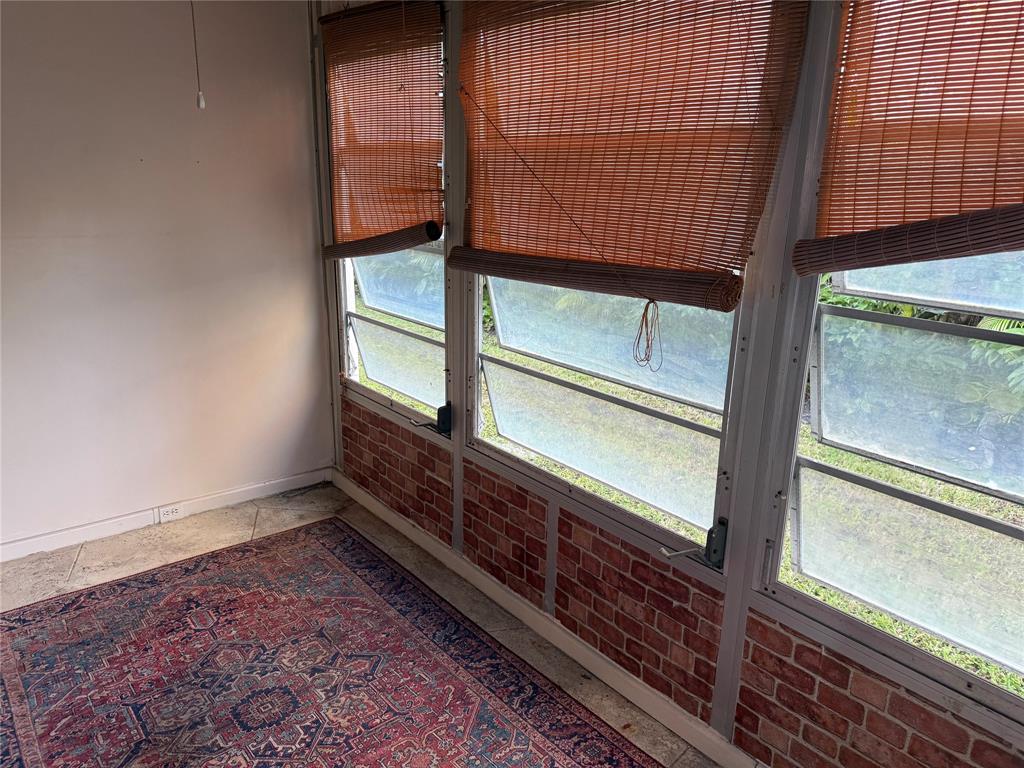 2115 Northeast 42nd Court, Unit 105N Lighthouse Point, FL 33064 - Photo 13 of 17 a view of a back yard of the house