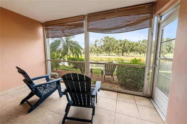 a view of a room with furniture and wooden floor