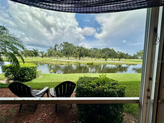 a living room with a bed furniture and a window