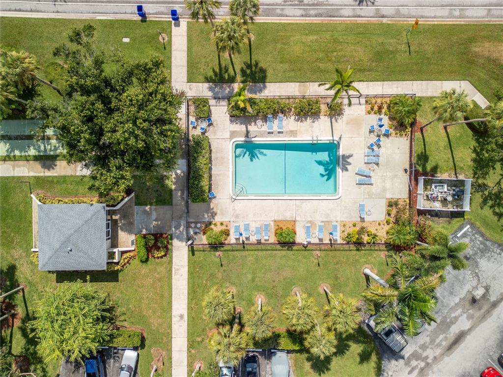 7351 West Country Club Drive North, Unit 103 Sarasota, FL 34243 - Photo 23 of 26 an aerial view of a house with a yard swimming pool and outdoor seating