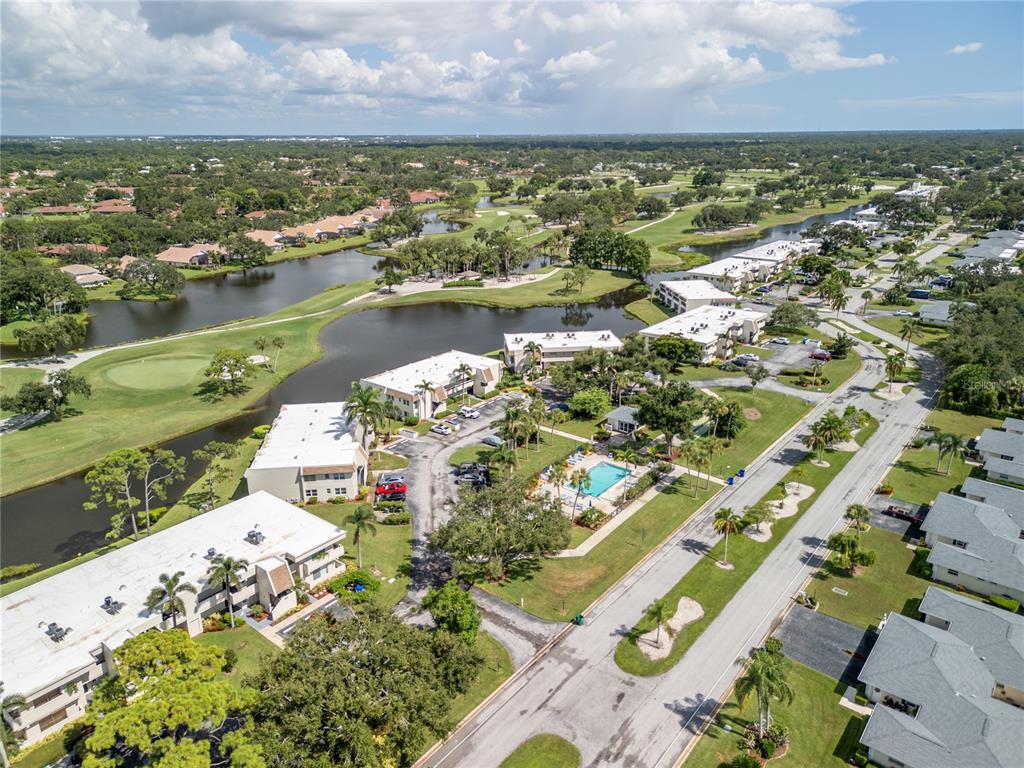 7351 West Country Club Drive North, Unit 103 Sarasota, FL 34243 - Photo 24 of 26 an aerial view of residential houses with outdoor space