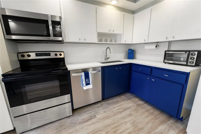 a kitchen with a stove and a microwave