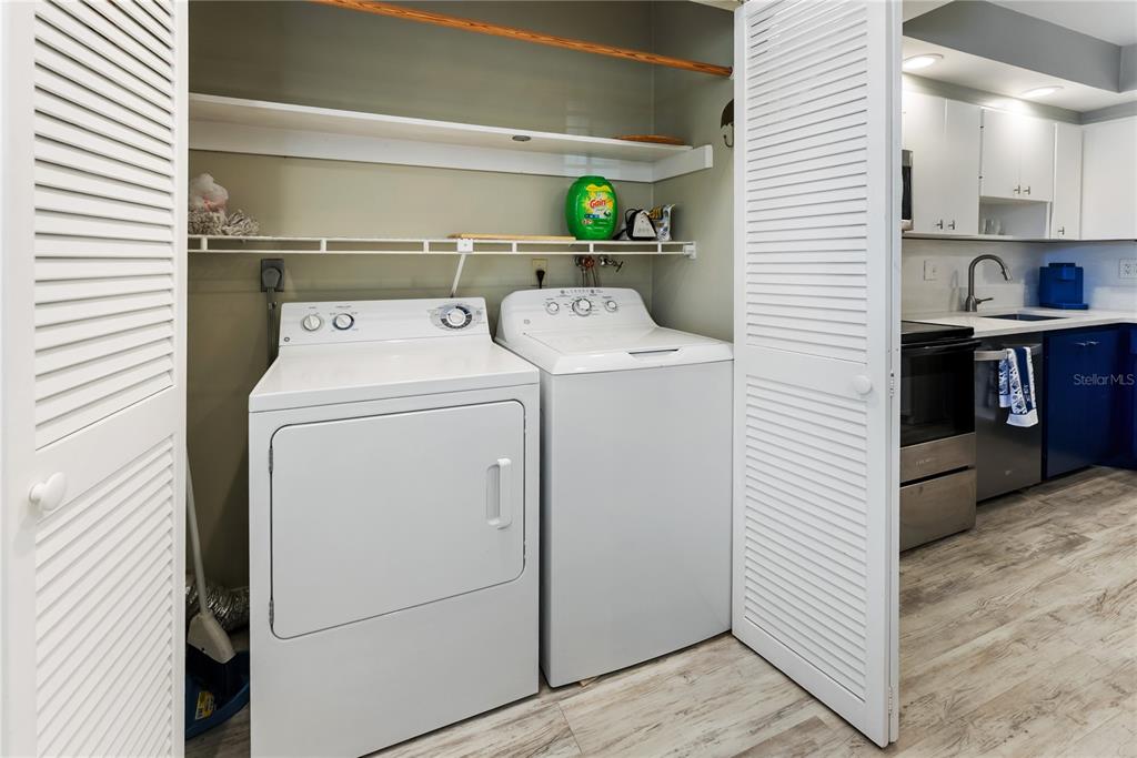 7351 West Country Club Drive North, Unit 103 Sarasota, FL 34243 - Photo 10 of 26 a utility room with dryer and washer