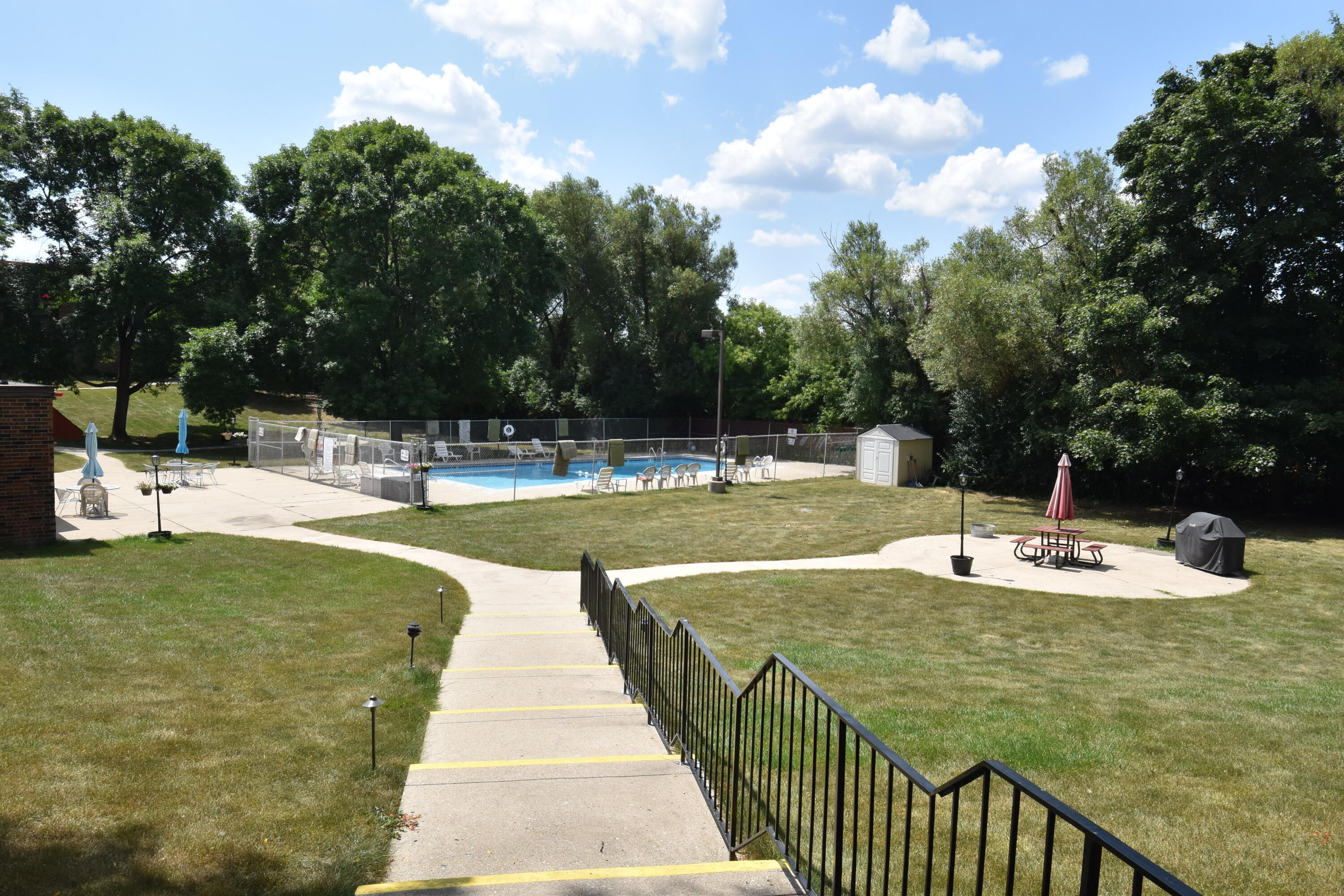 5253 North Lovers Lane Road, Unit 219 Milwaukee, WI 53225 - Photo 25 of 39 Summer view of Green Space