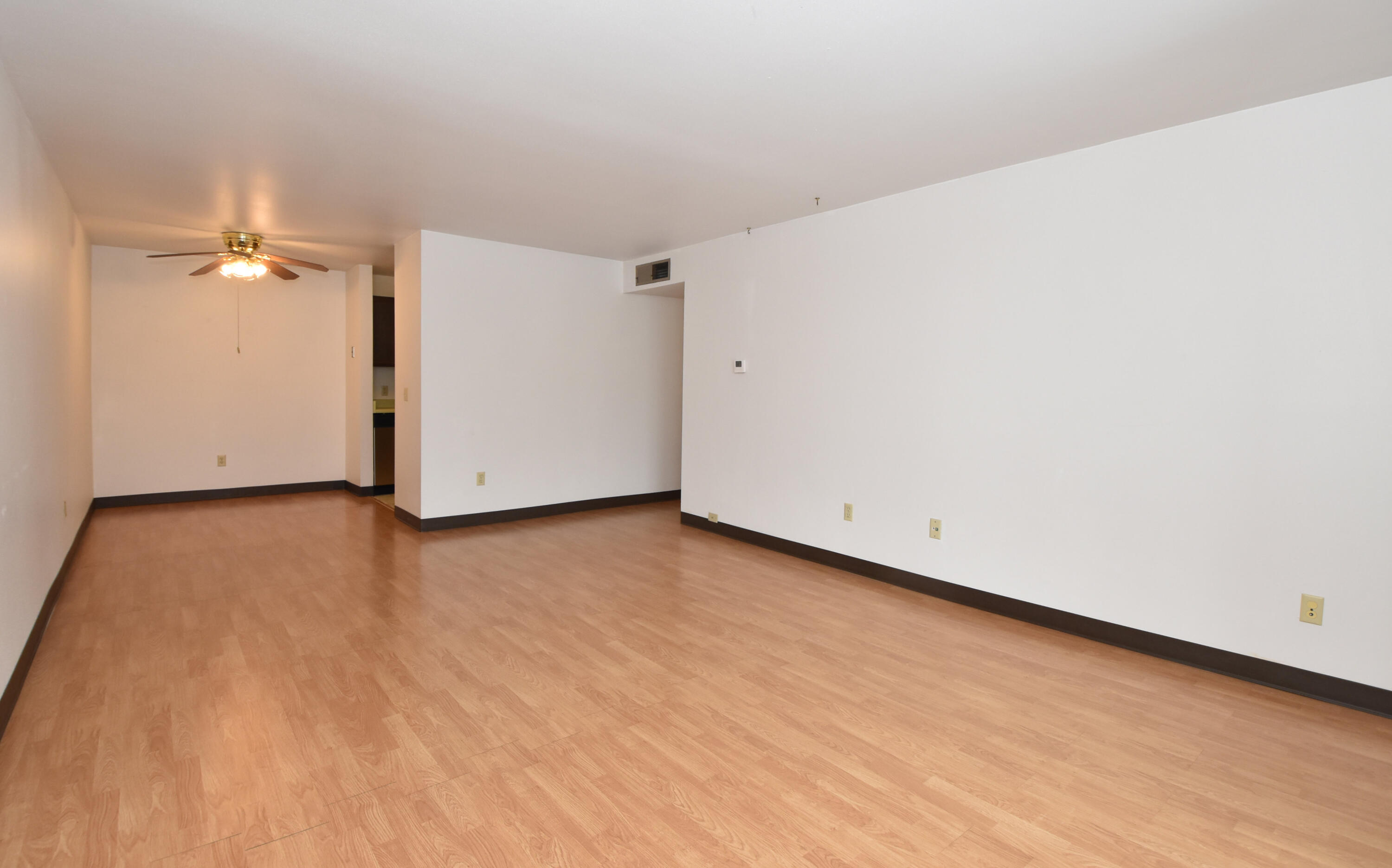 5253 North Lovers Lane Road, Unit 219 Milwaukee, WI 53225 - Photo 4 of 39 Living Room into DR