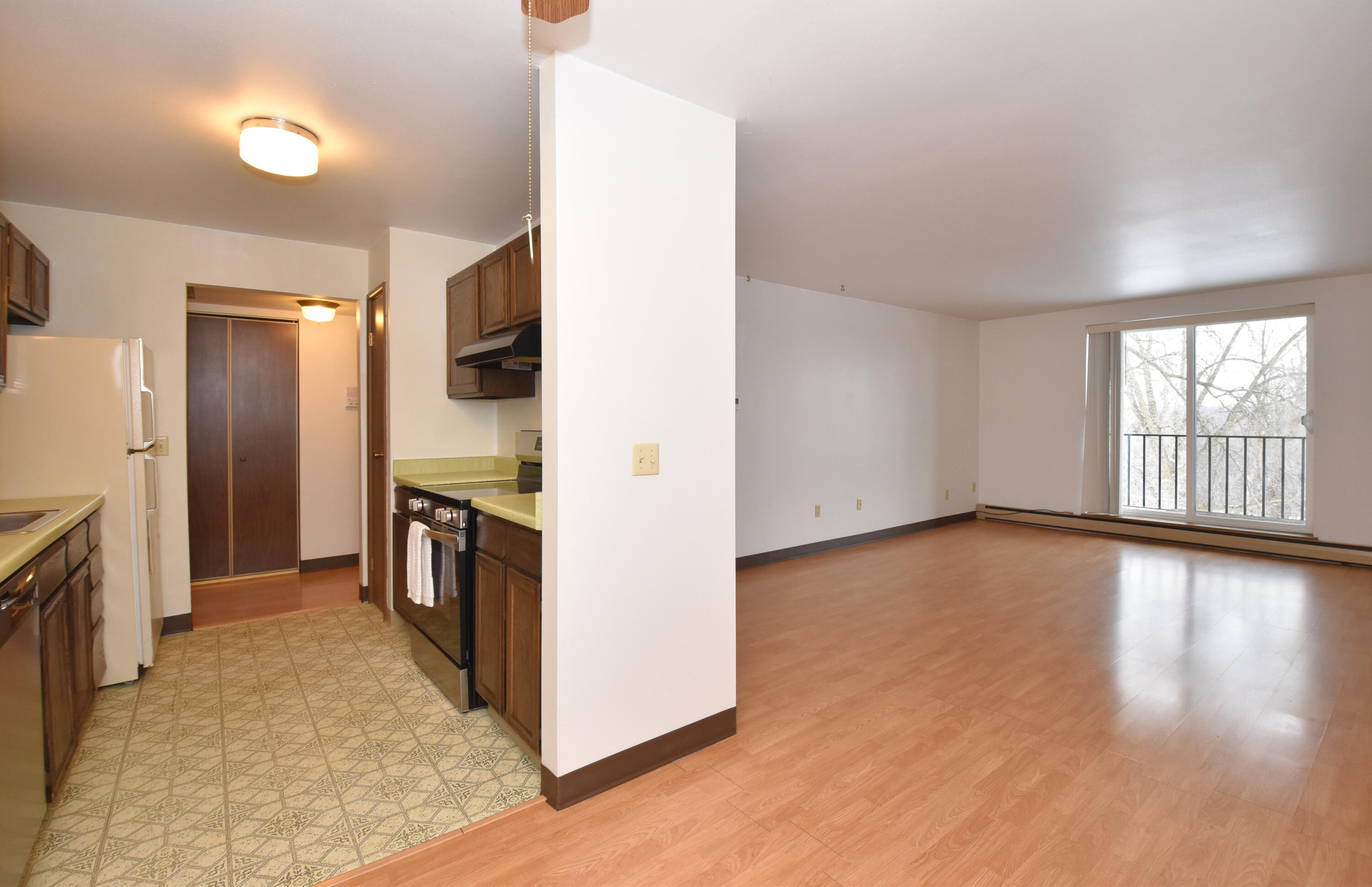 5253 North Lovers Lane Road, Unit 219 Milwaukee, WI 53225 - Photo 7 of 39 Dining Room into Kitchen