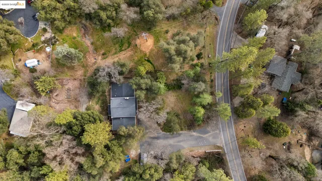 a view of a town with mountains in the background