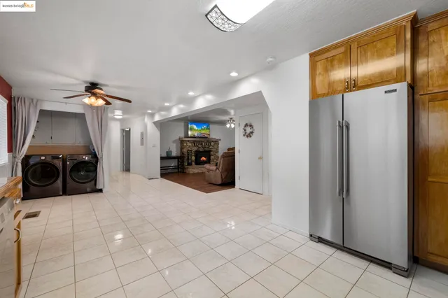 a kitchen with stainless steel appliances a refrigerator and a sink