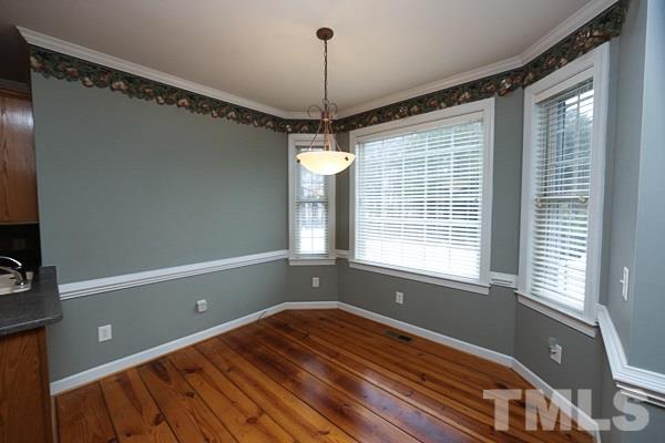 1008 Fieldgrass Place Raleigh, NC 27603 - Photo 5 of 13 a view of a room with window and wooden floor