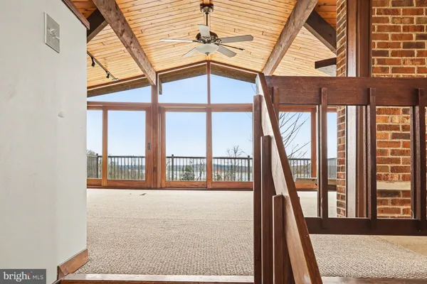 a view of a room with wooden walls