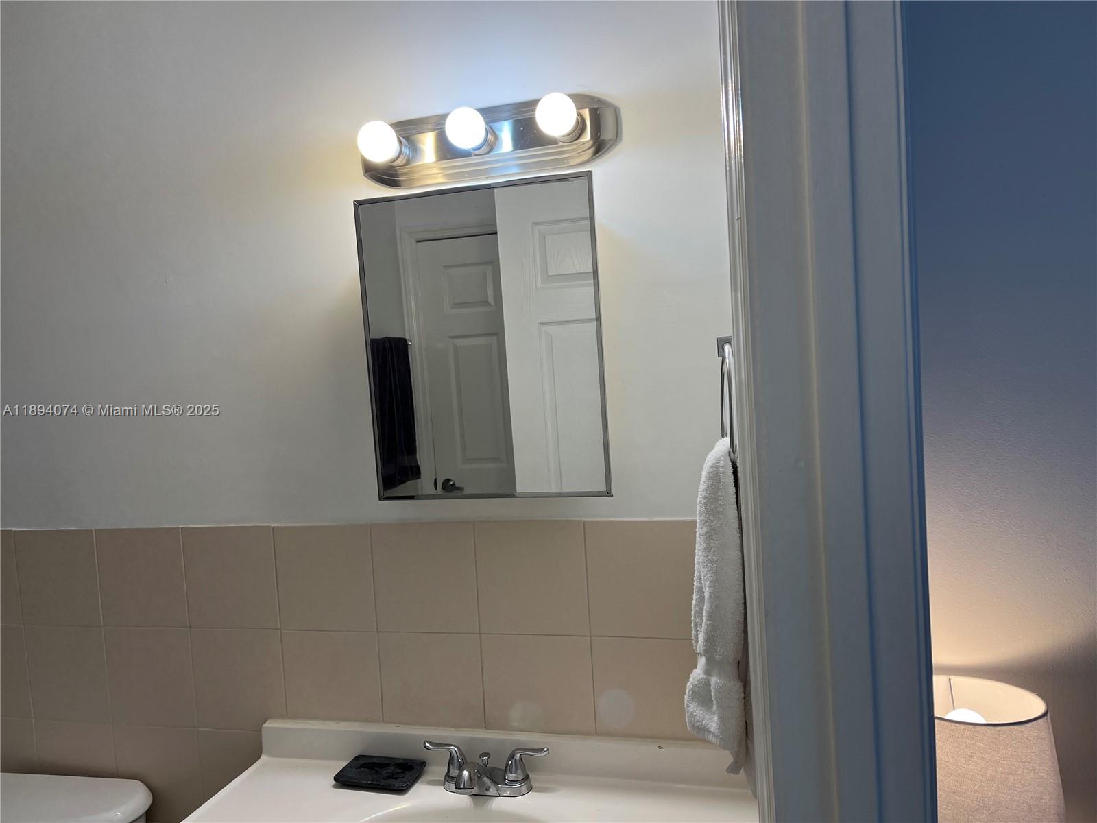 1020 Southwest 4th Street, Unit 103 Miami, FL 33130 - Photo 7 of 11 a bathroom with a toilet and a sink