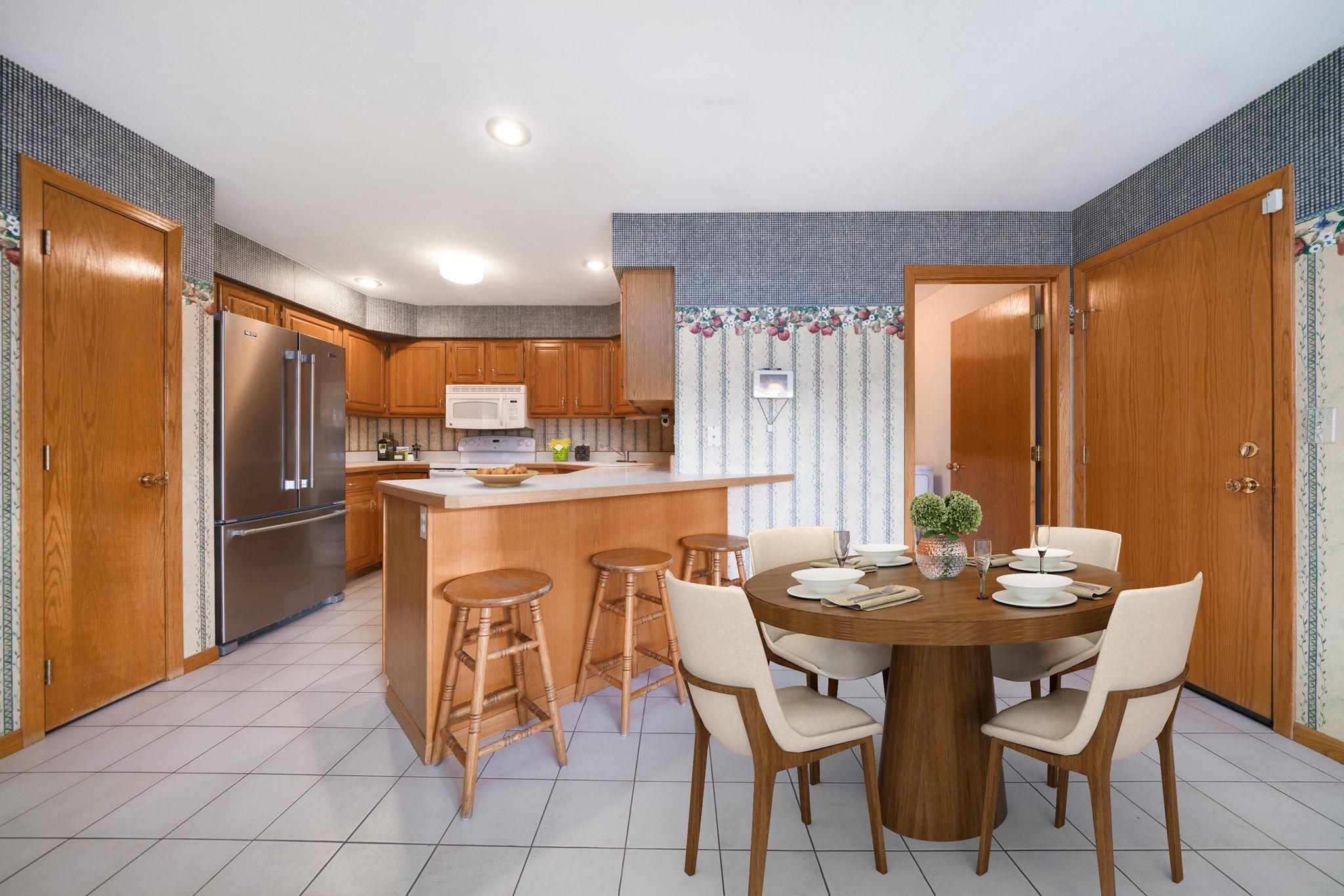 1196 South Trainer Road Rockford, IL 61108 - Photo 4 of 33 a dining room with stainless steel appliances a table and chairs