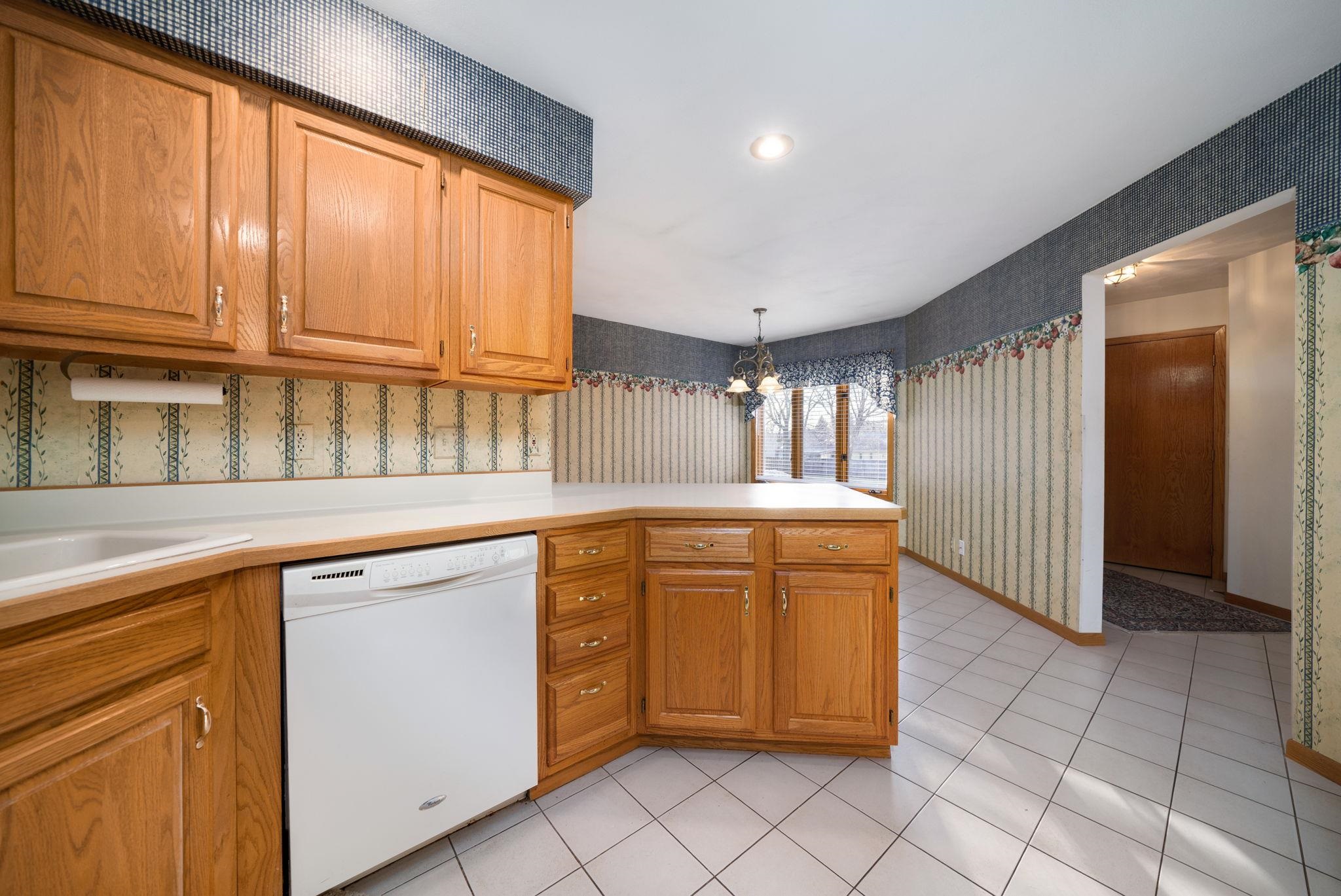 1196 South Trainer Road Rockford, IL 61108 - Photo 7 of 33 a kitchen that has a sink and cabinets